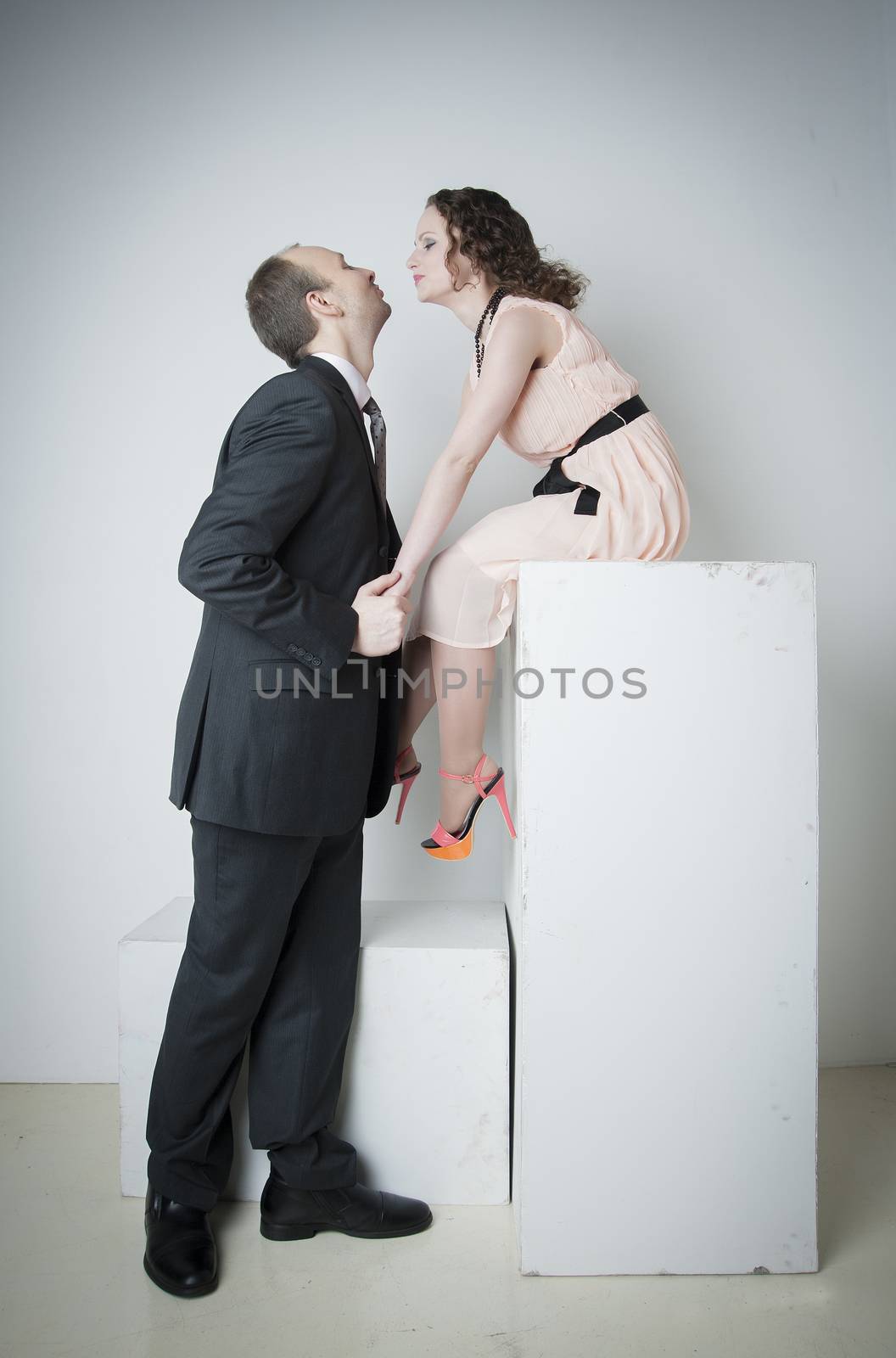 young man and woman look at each other in the Studio