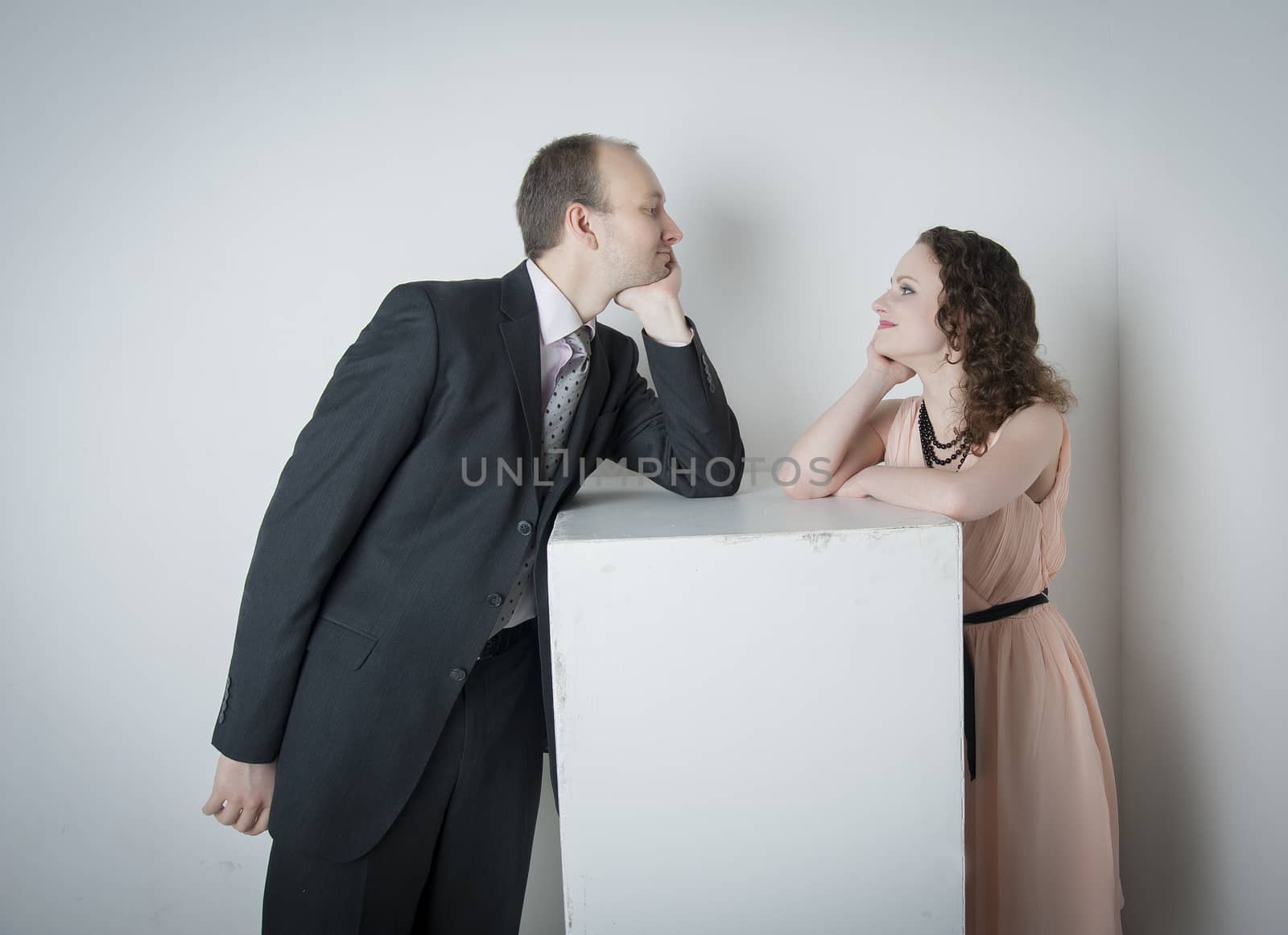 young man and woman look at each other in the Studio