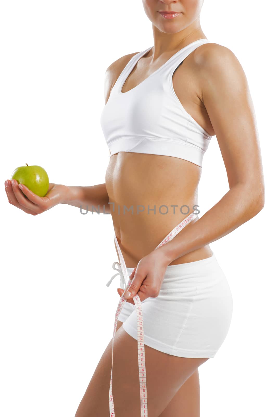 young athletic woman holding a green apple by adam121