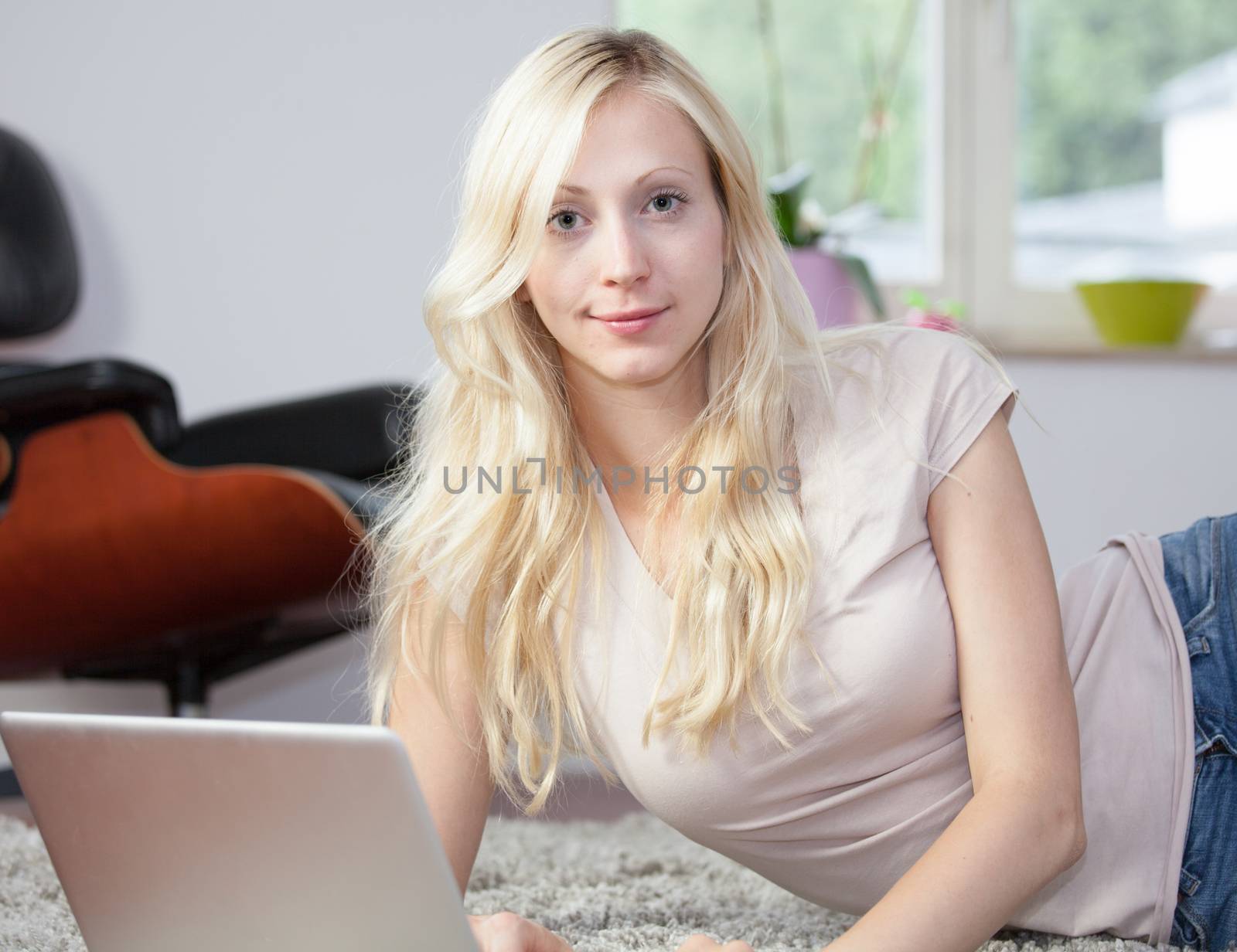 Relaxed woman is using laptop by aa-w