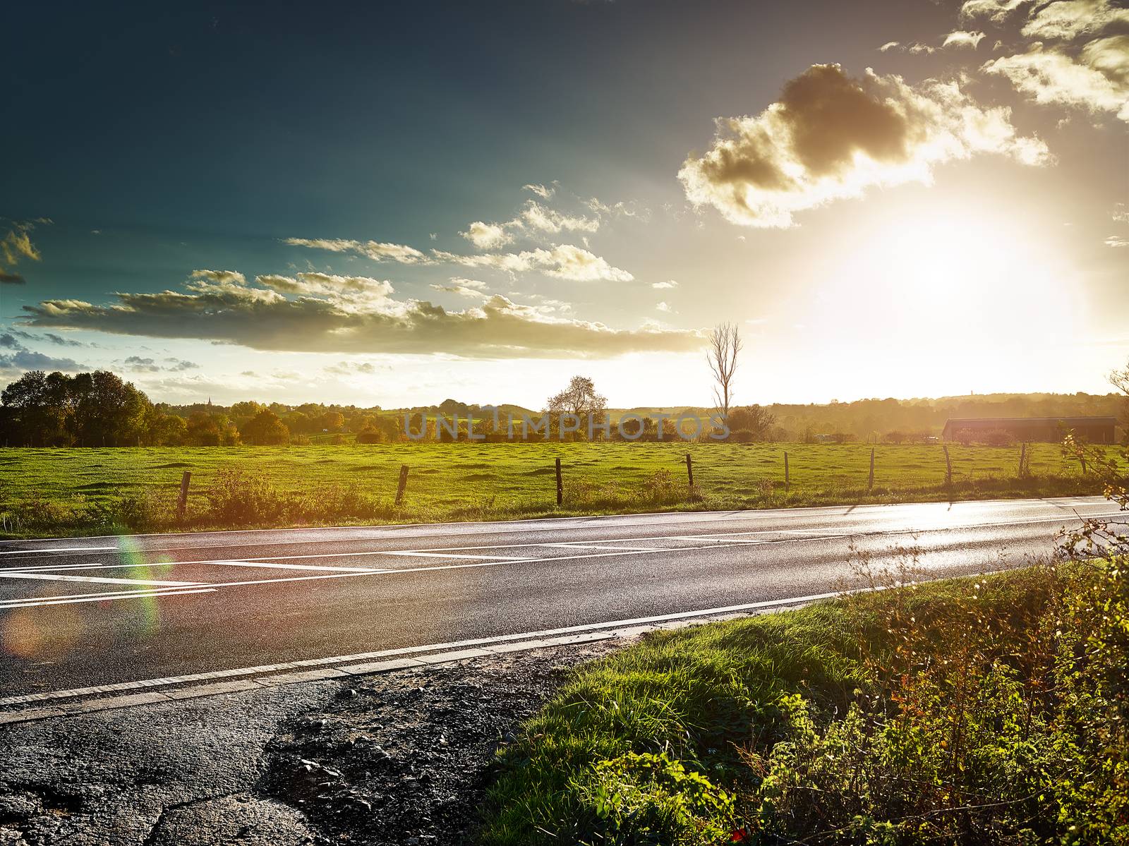 country road at sundown, cloudy backlite shot. peferct for car copy space