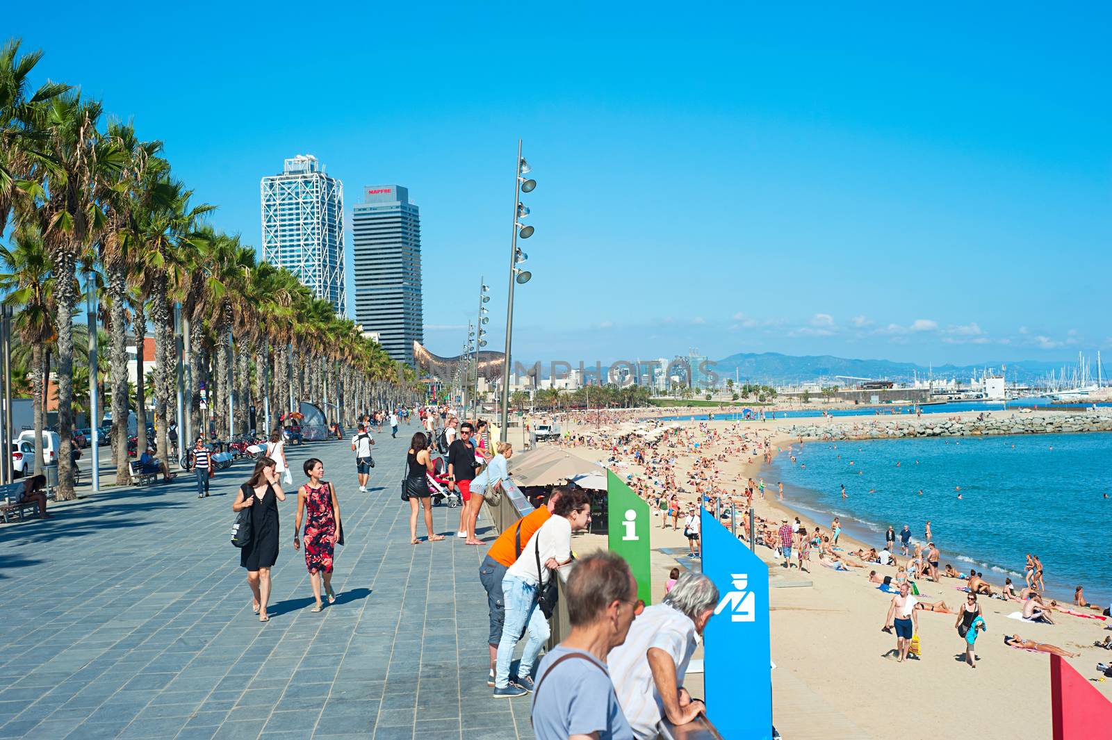 BARCELONA, SPAIN - SEPT 23, 2013: Unidentified people at Barcelona city beach. 400 meters long, it is one of 10 best urban beaches of the world.