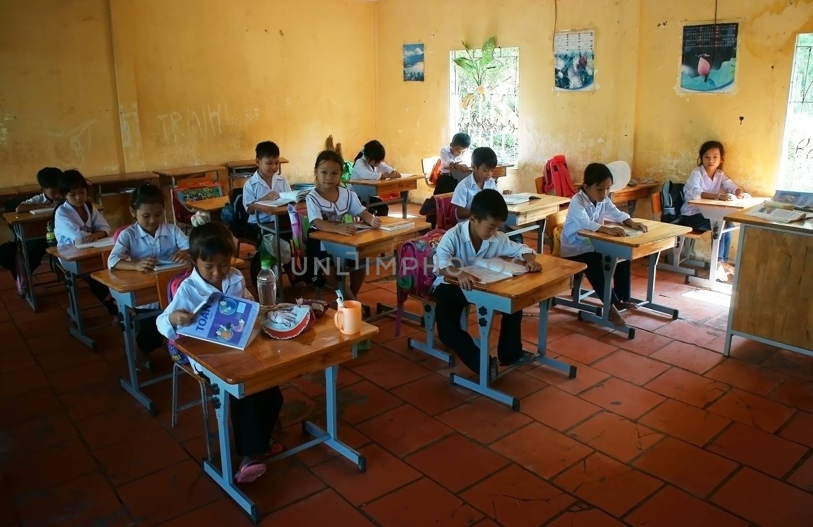 LONG AN, VIET NAM- NOV 11: Primary pupil in school time of primary school in Long An, VietNam on Nov 11, 2013