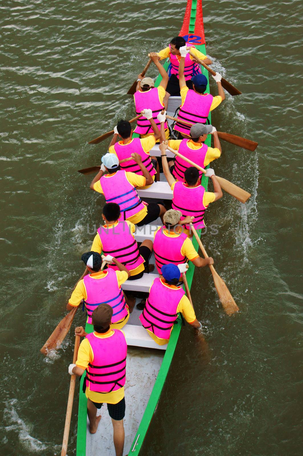 SAI GON, VIET NAM- APRIL 27: Racer in competition at dragon boat race, Sai Gon, Viet Nam, April 27, 2013