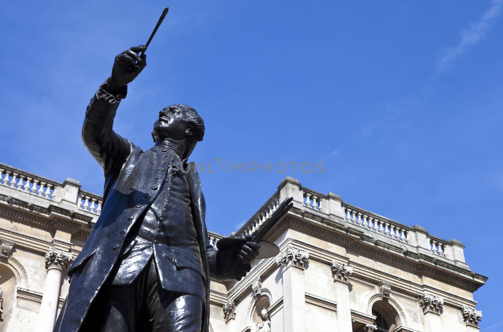 Statue of English painter Joshua Reynolds situated at Burlington House which houses the Royal Academy of Art in London.