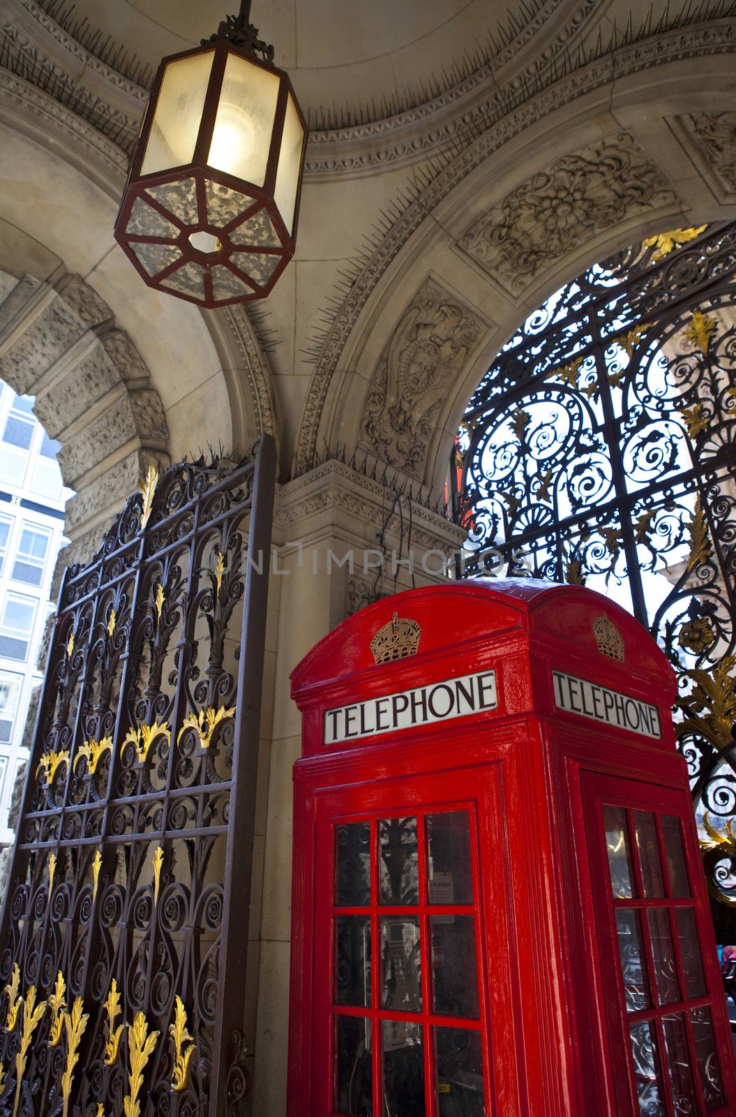 An iconic red Telephone Box in an elegant area of London.