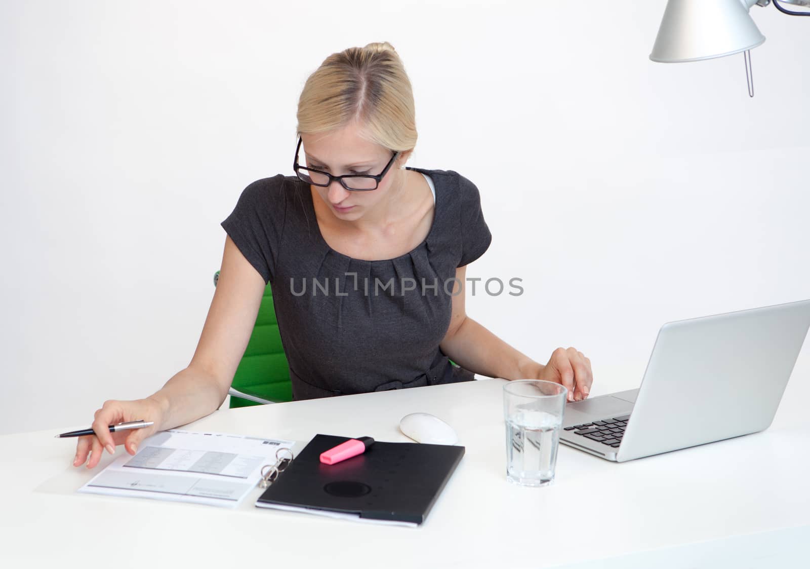 Young Business woman is smiling while working at work desk
