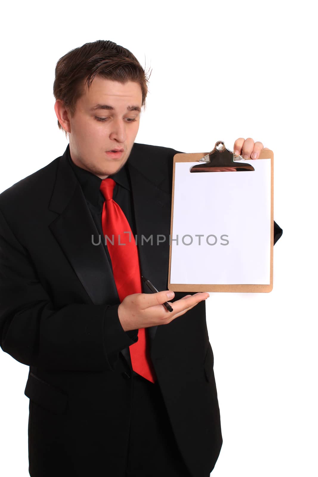 Businessman  holding a clipboard with a blank page on a white background
