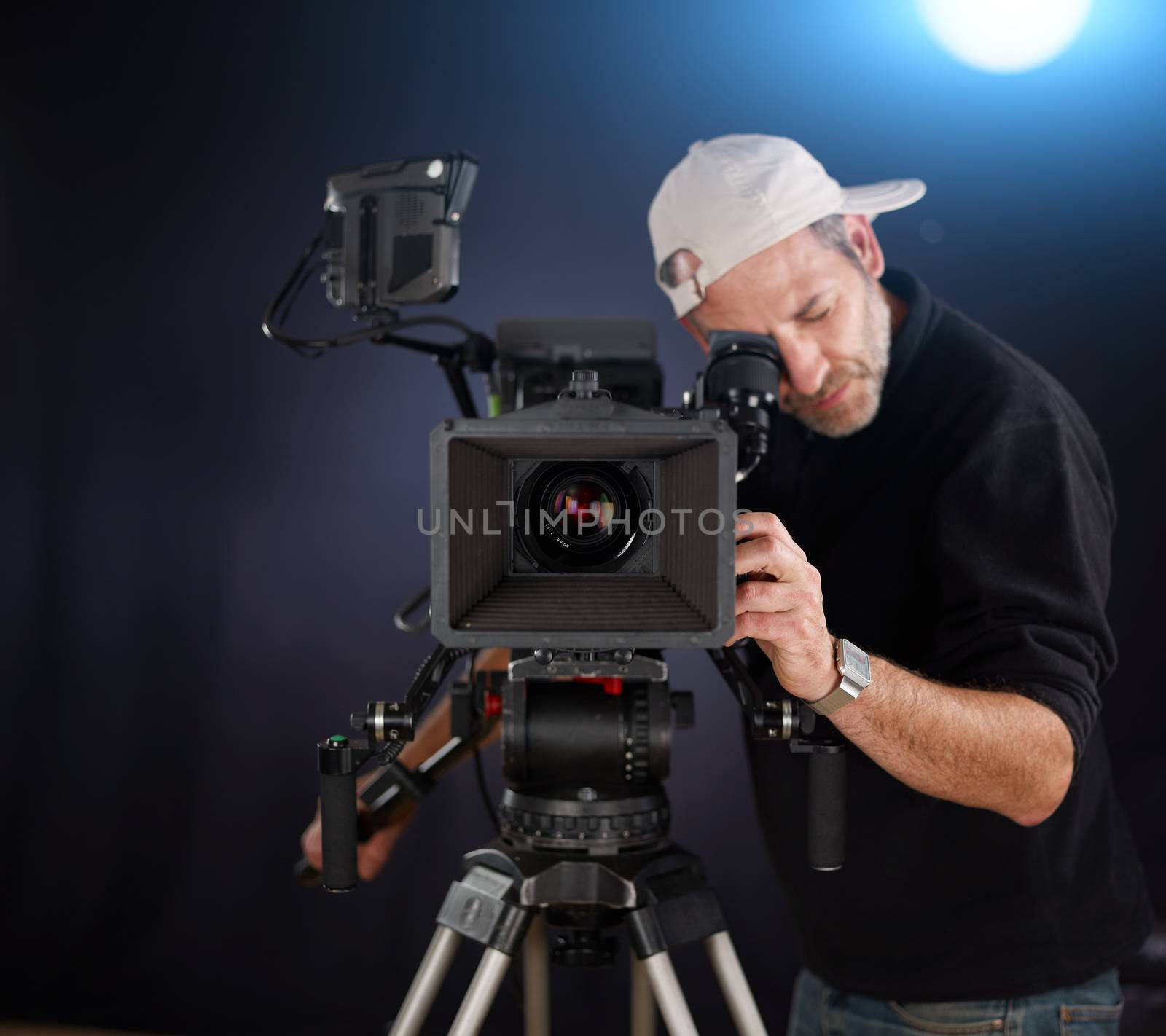 cameraman working with a cinema camera by aa-w