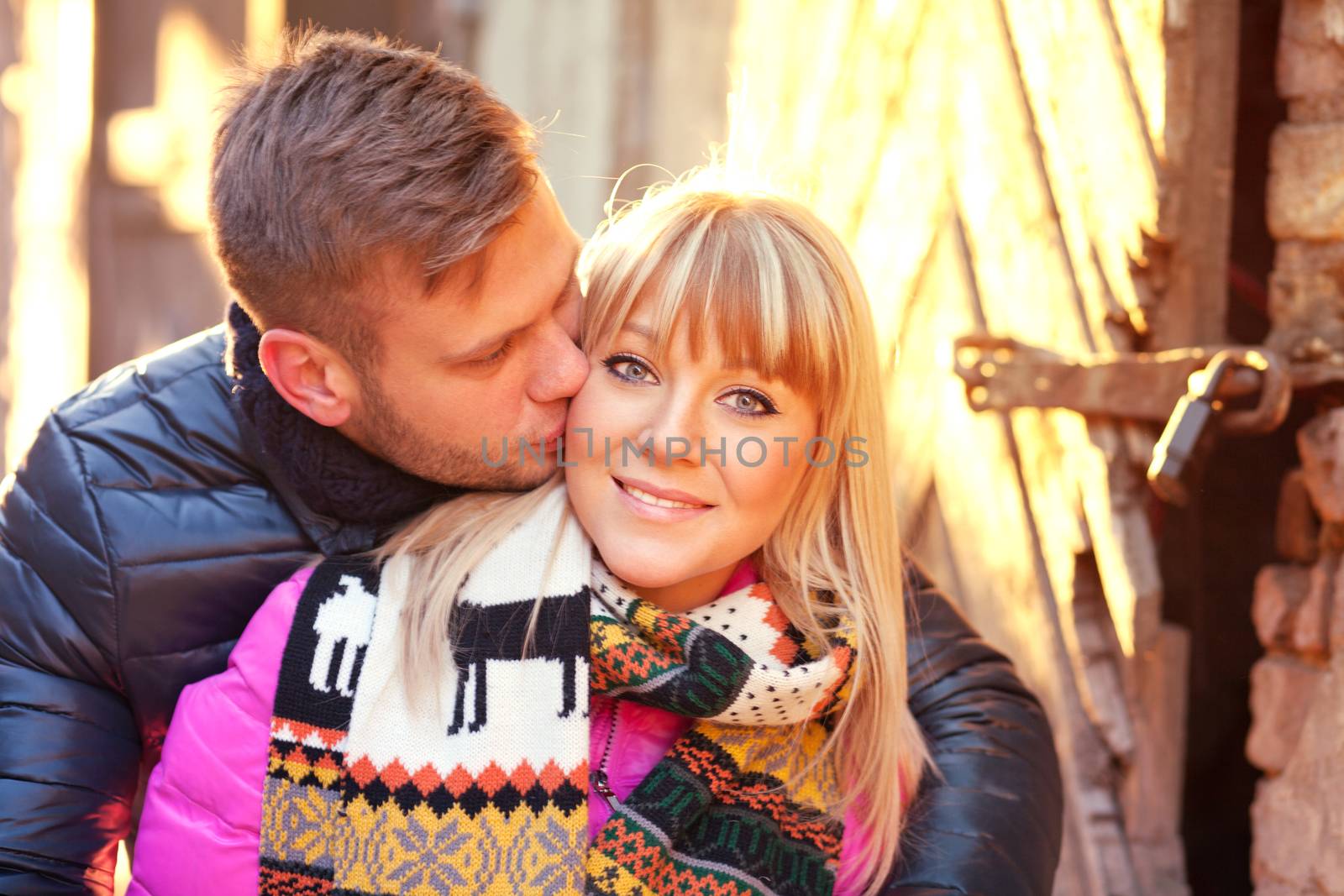 Young couple kissing on the street of old Riga