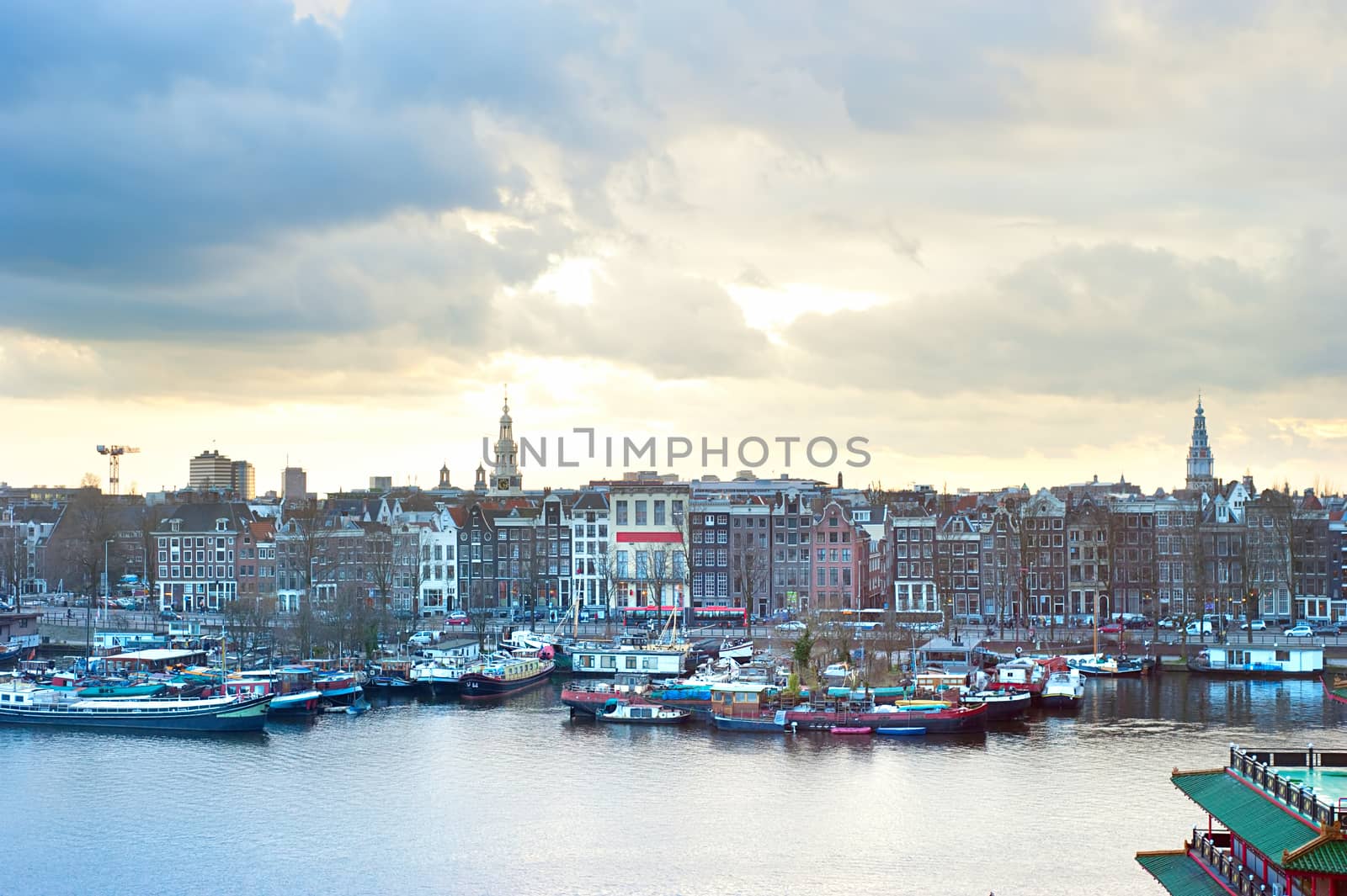 Skyline of Amsterdam at colorful dusk. Aerial view