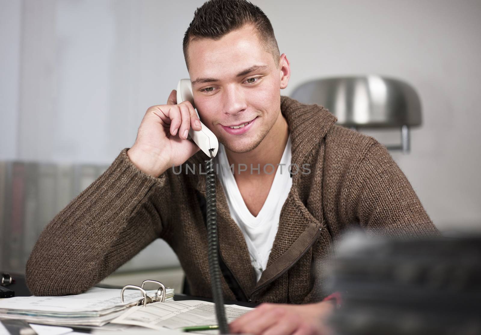 Businessman having conversation on telephone by aa-w