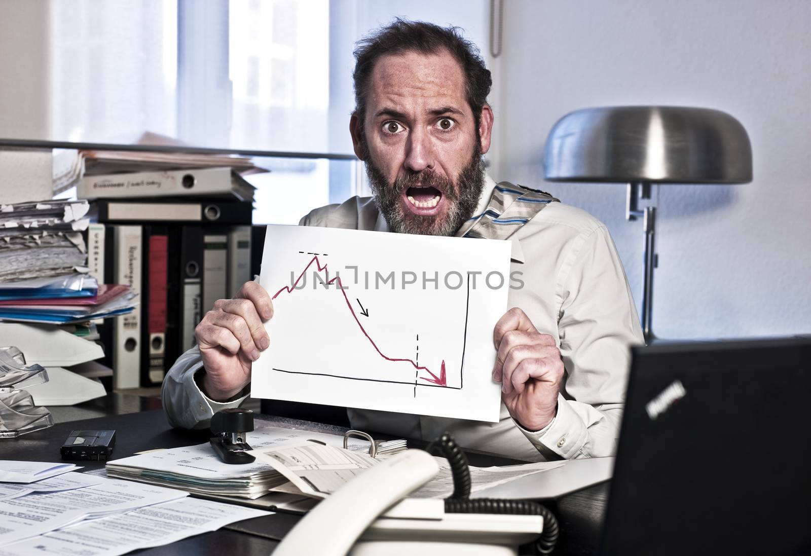 Businessman sees the bankrupcy and gets panic {shot on PhaseOne P45}