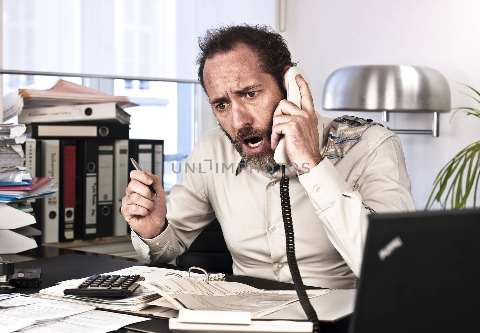 Businessman goes upset while on the phone {shot on PhaseOne P45}