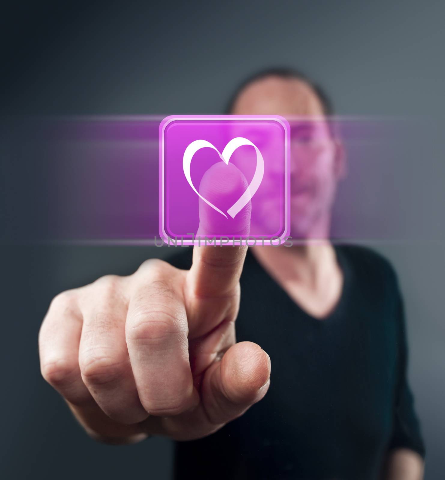 Close-up of man touching heart shape icon
