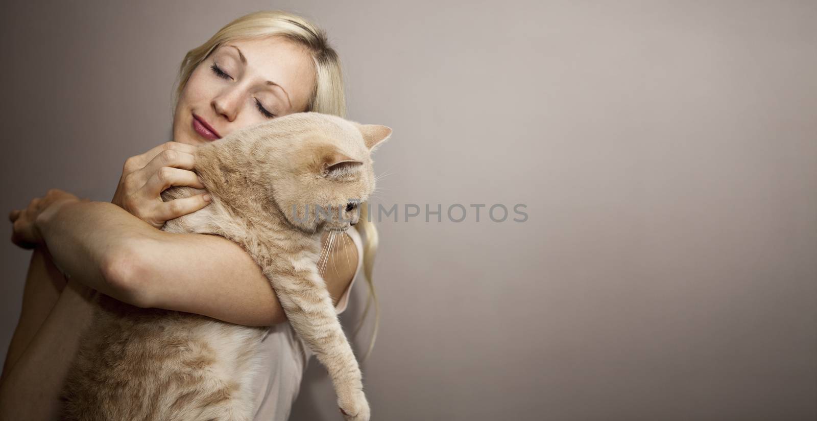 Young Woman loves her cute Cat