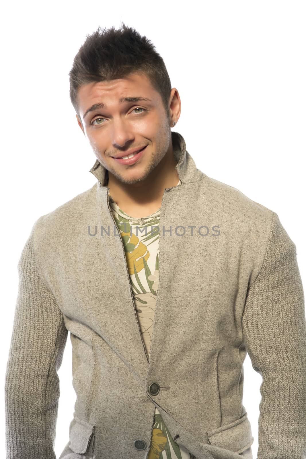 Smiling young man with wool sweater on white background by artofphoto