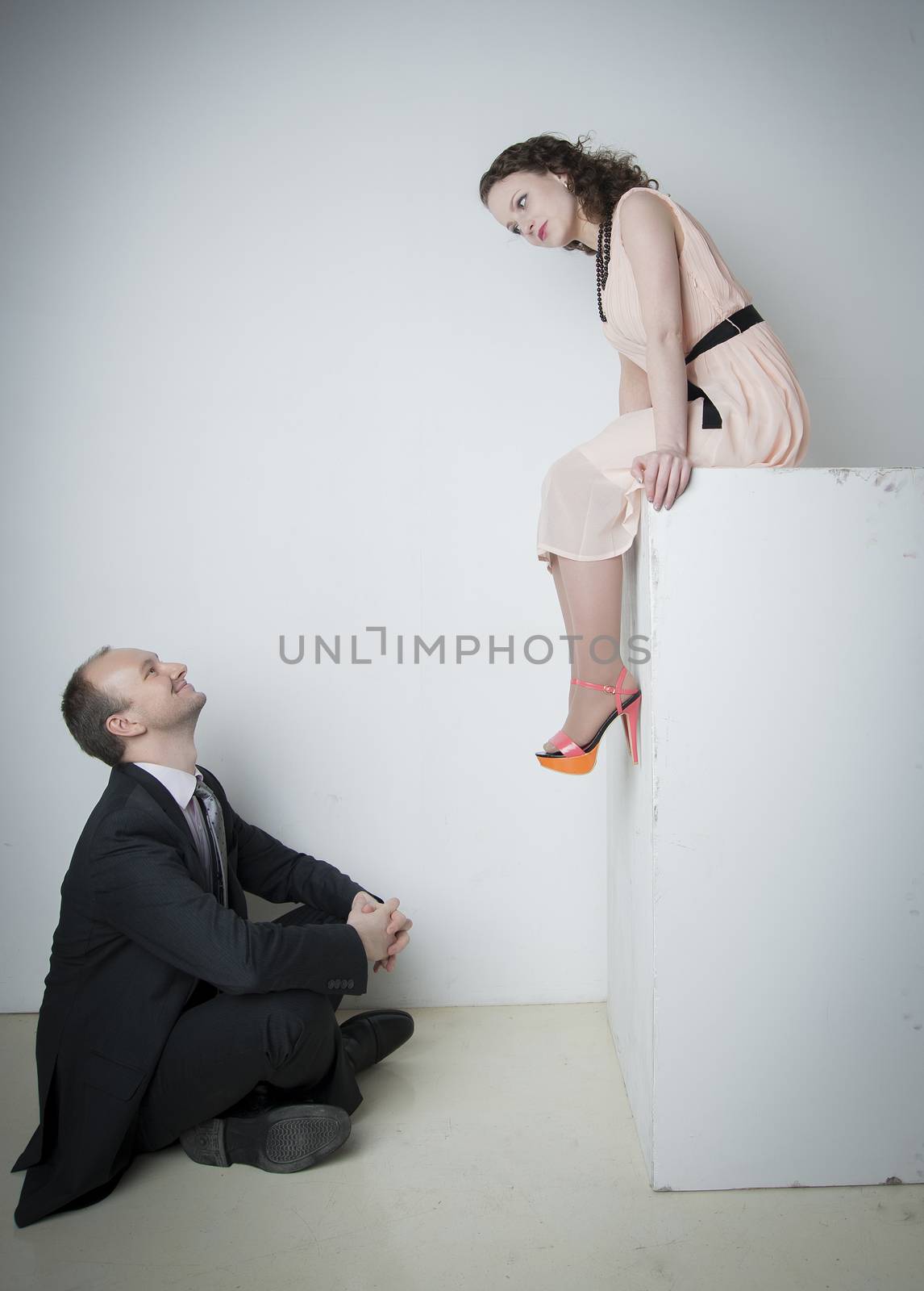 young man and woman look at each other in the Studio