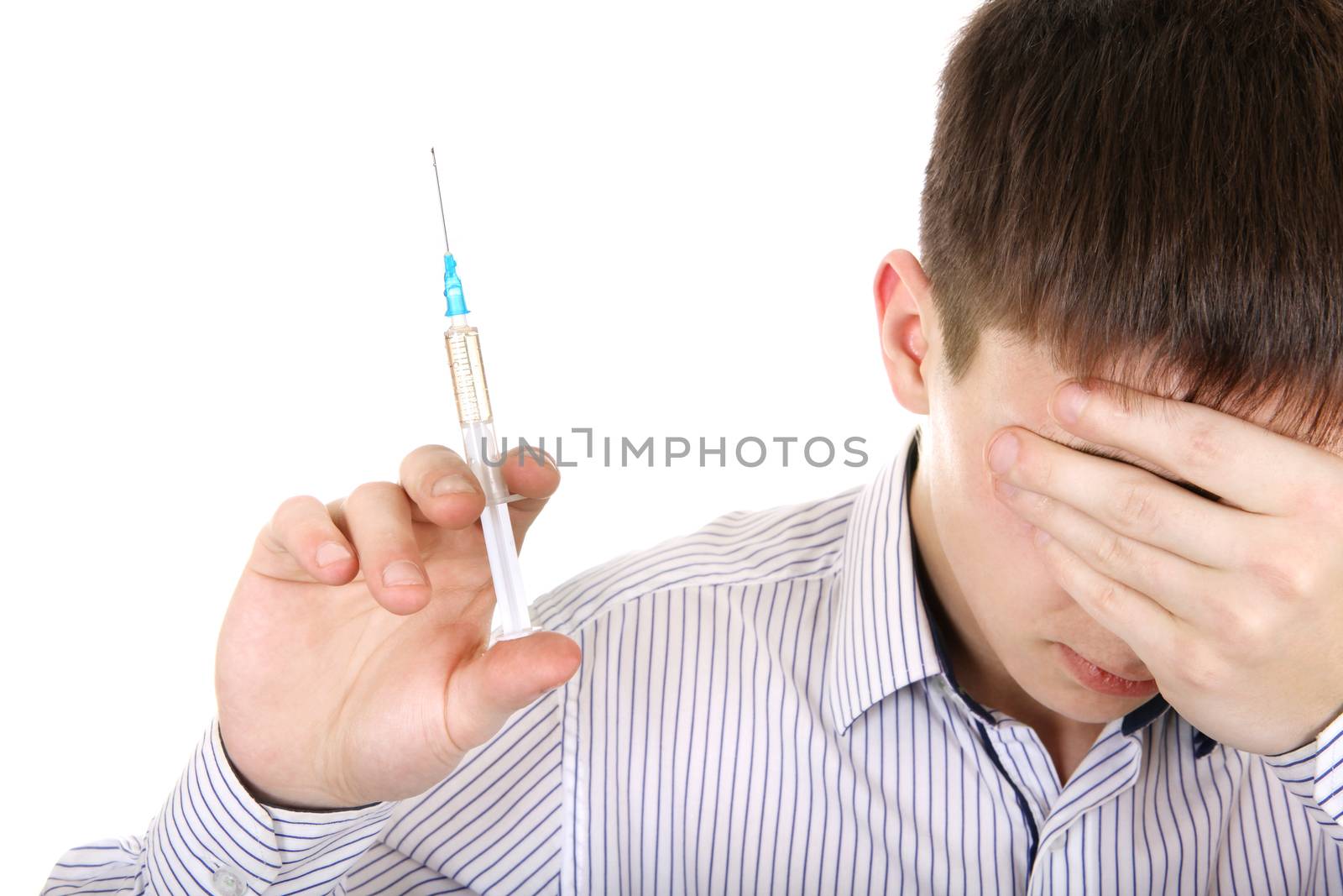 Sad Teenager with Syringe Isolated on the White Background