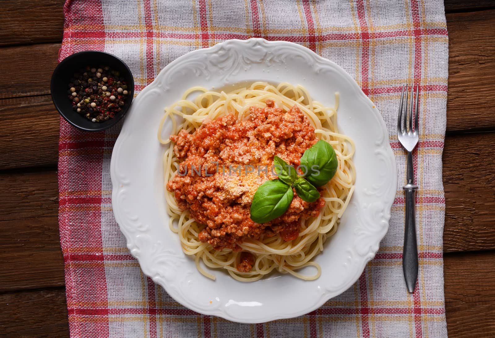Tasty spaghetti with cheese and basil
