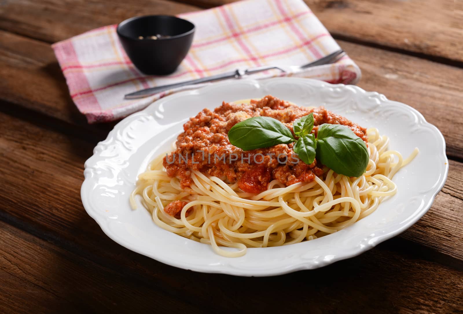 Tasty spaghetti with cheese and basil