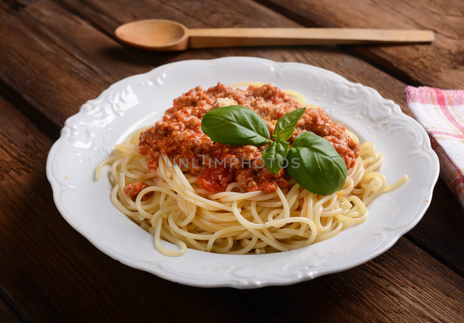 Tasty spaghetti with cheese and basil