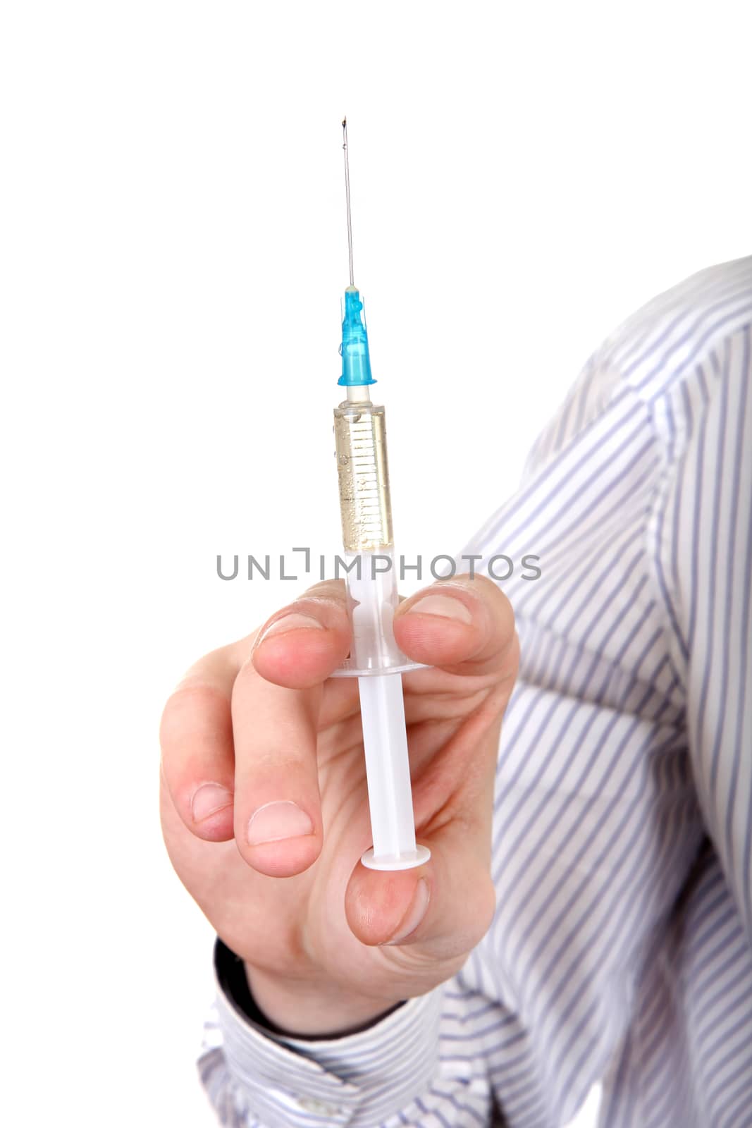 Syringe in a Hand Closeup Isolated on the White Background