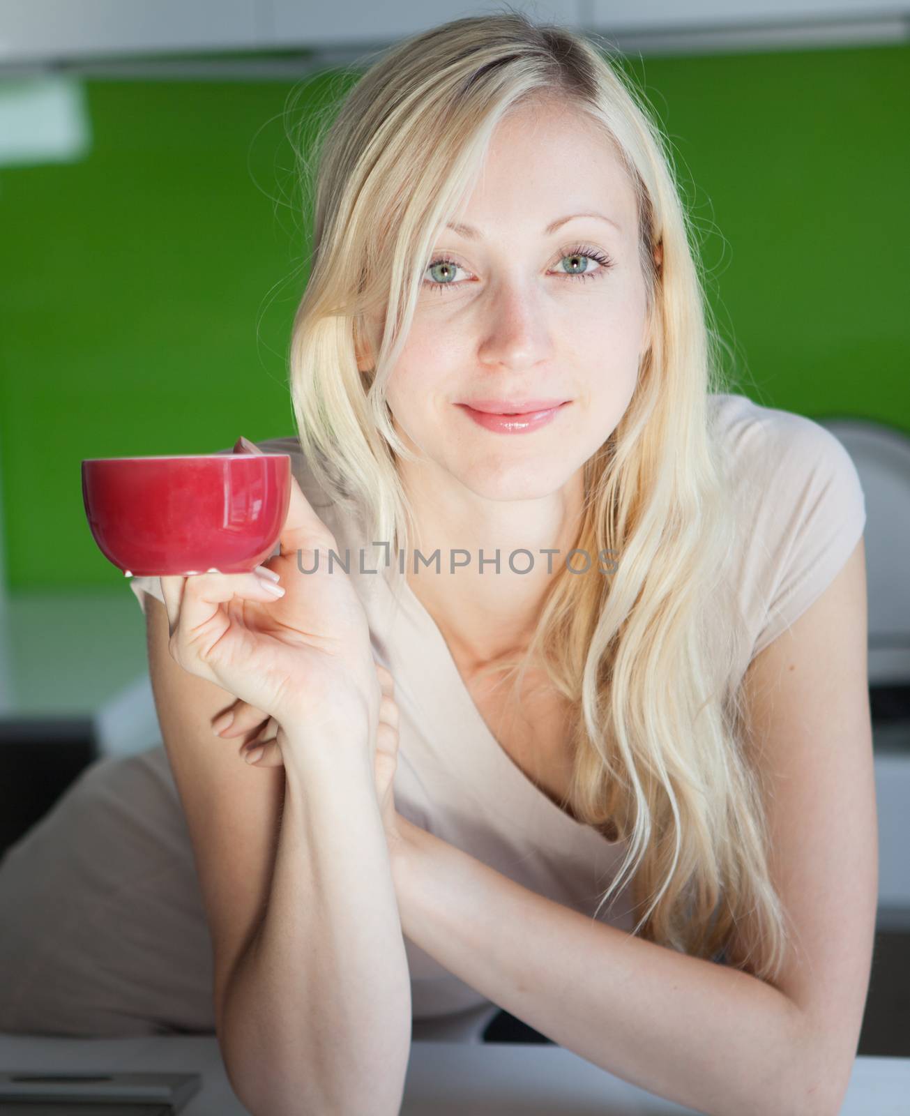Woman has coffee break at home by aa-w