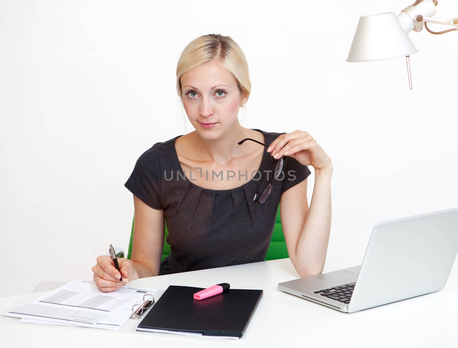 Young Business woman is smiling while working at work desk