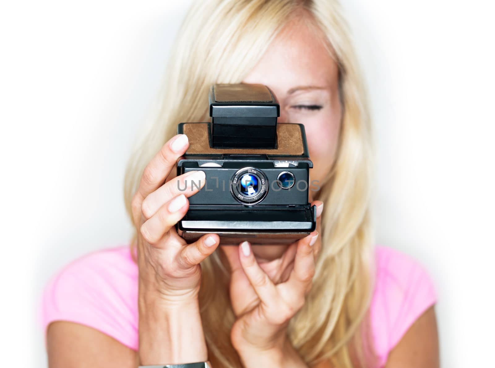 beautiful woman holds vintage photo camera