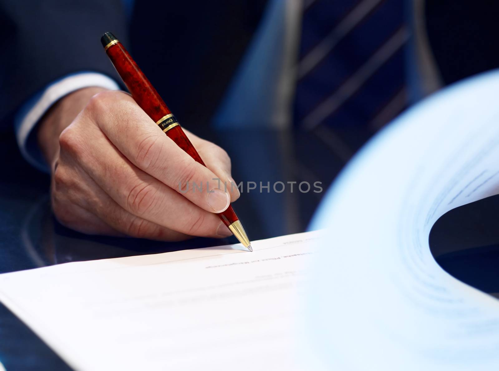 Close up of businessman signing a contract. by aa-w