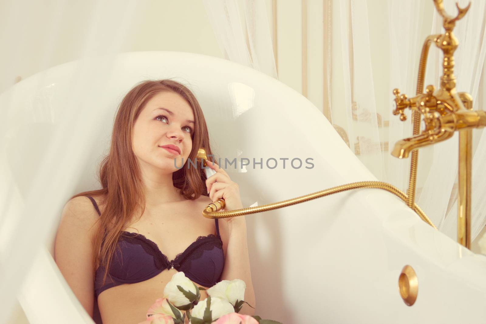 Portrait of a young  woman having fun in shower