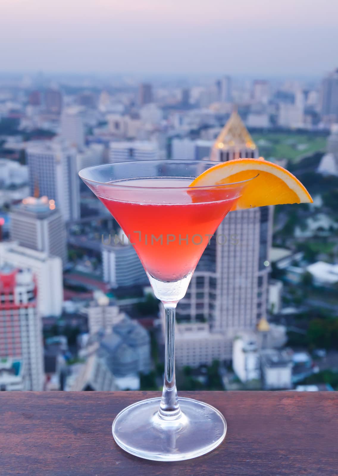 Red cocktail slide of orange stand on the roof