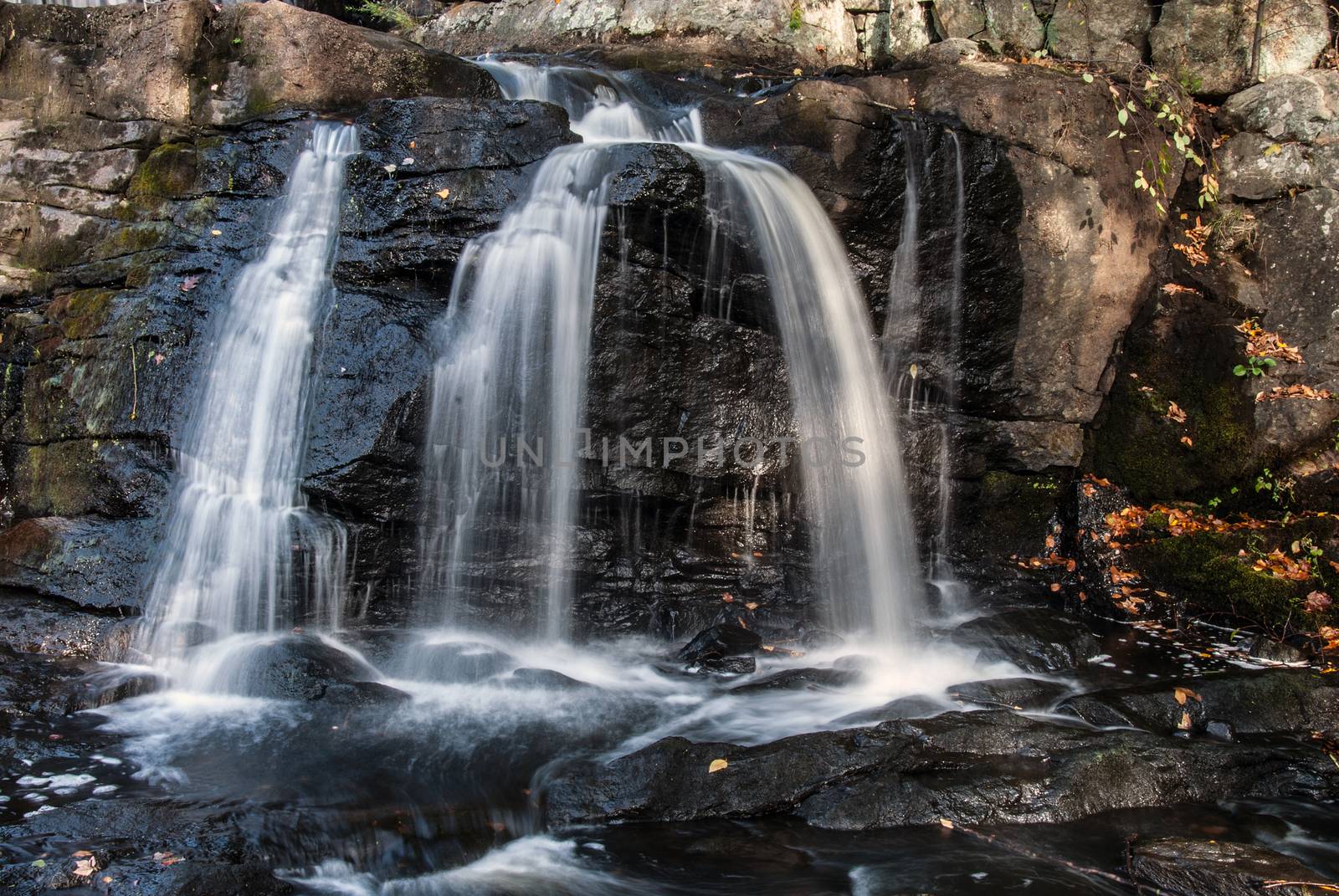 Water flowing at full force at a waterfall