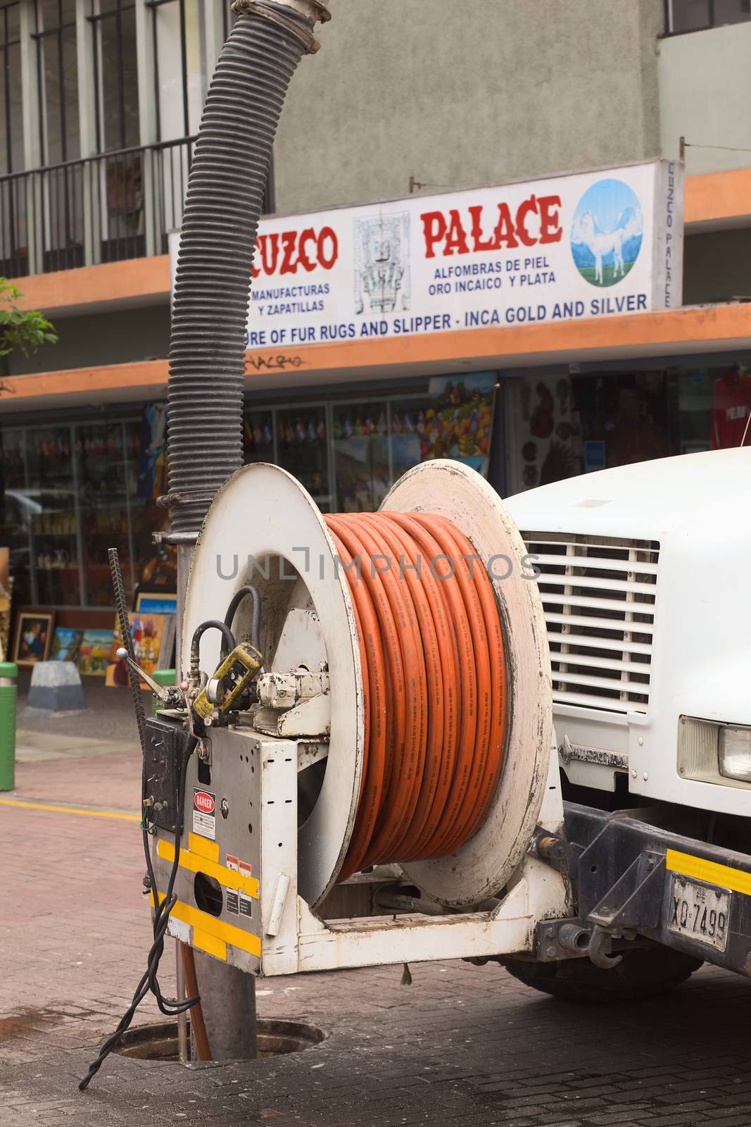 LIMA, PERU - FEBRUARY 11, 2012: Cleaning the sewage with the help of a truck on February 11, 2012 in Miraflores, Lima, Peru