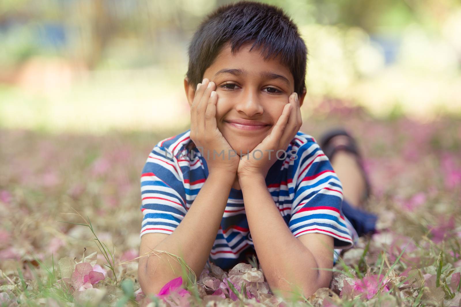 An handsome toddler having fun in the park