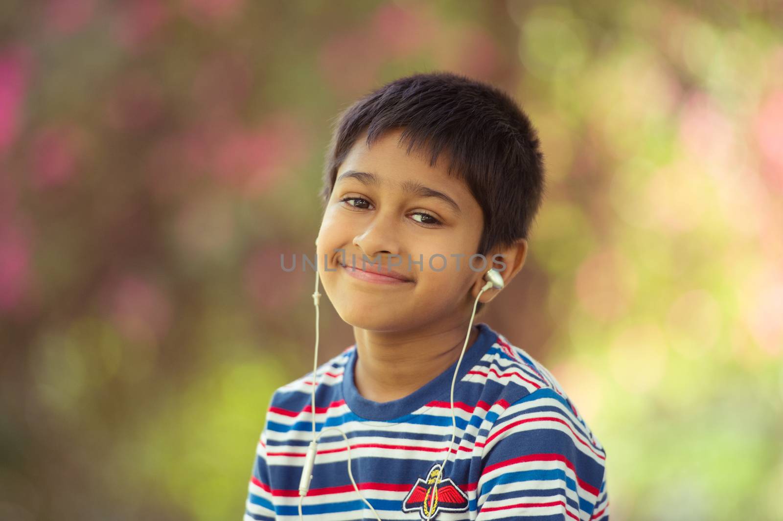 An handsome toddler having fun in the park