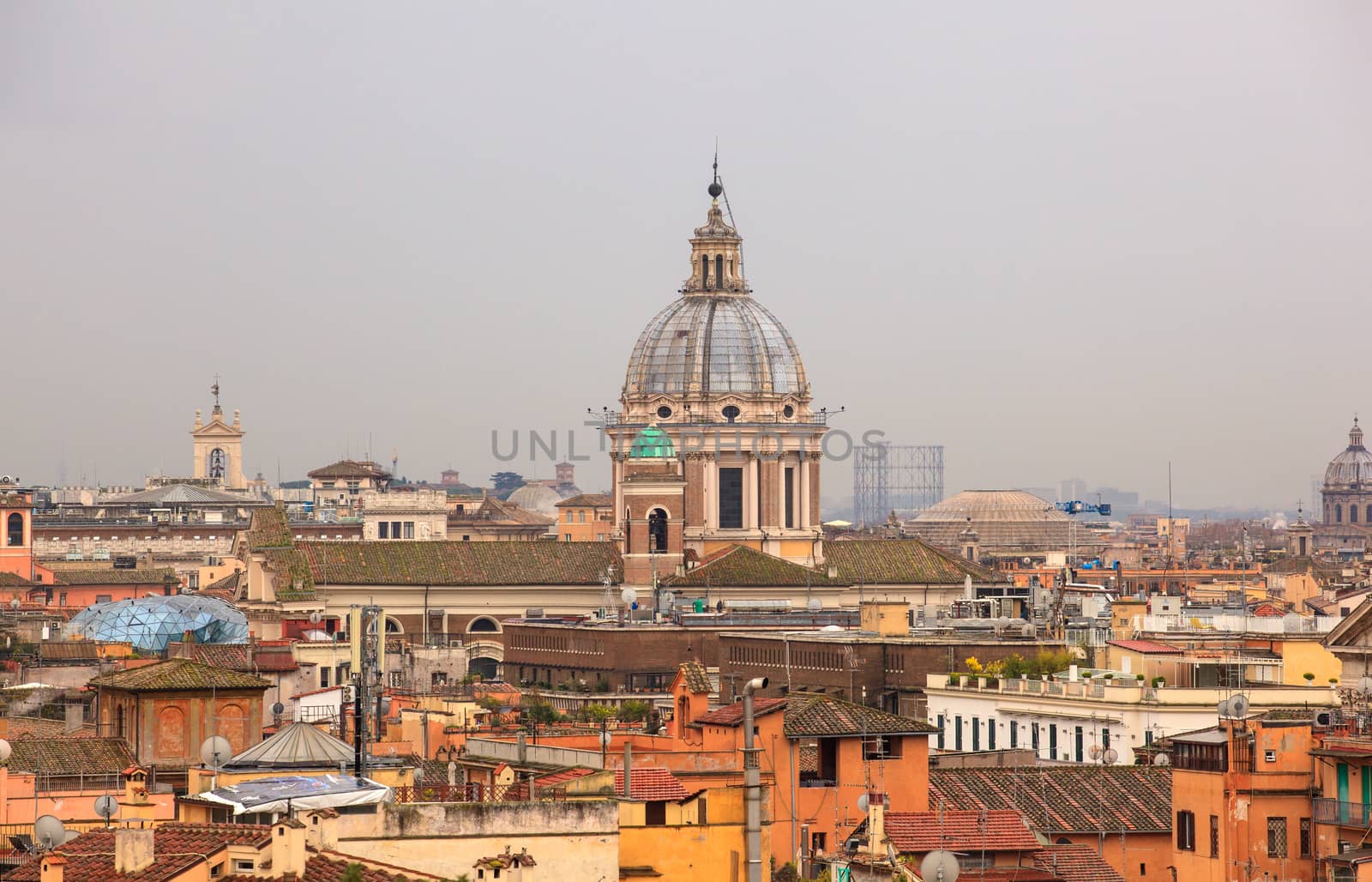 View of San Marcello al Corso church and Rome roofs from Pincio