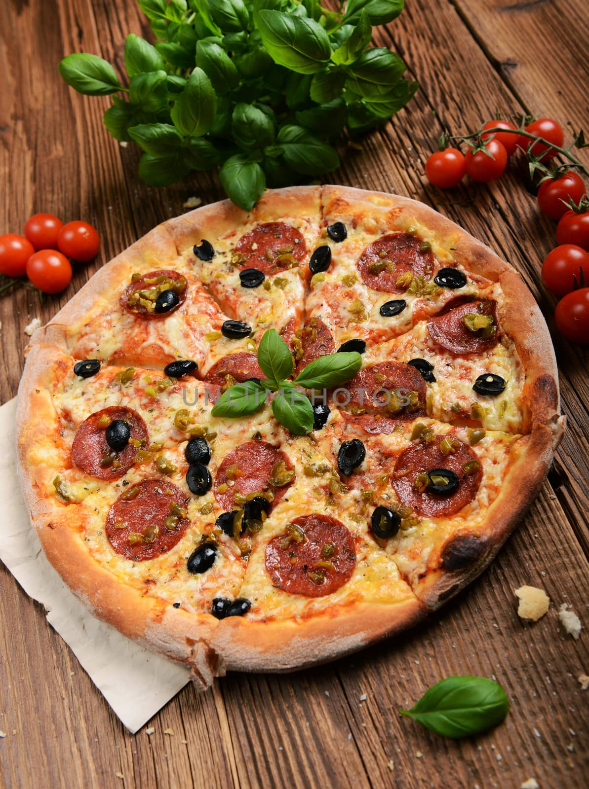 Tasty pizza with olives and salami