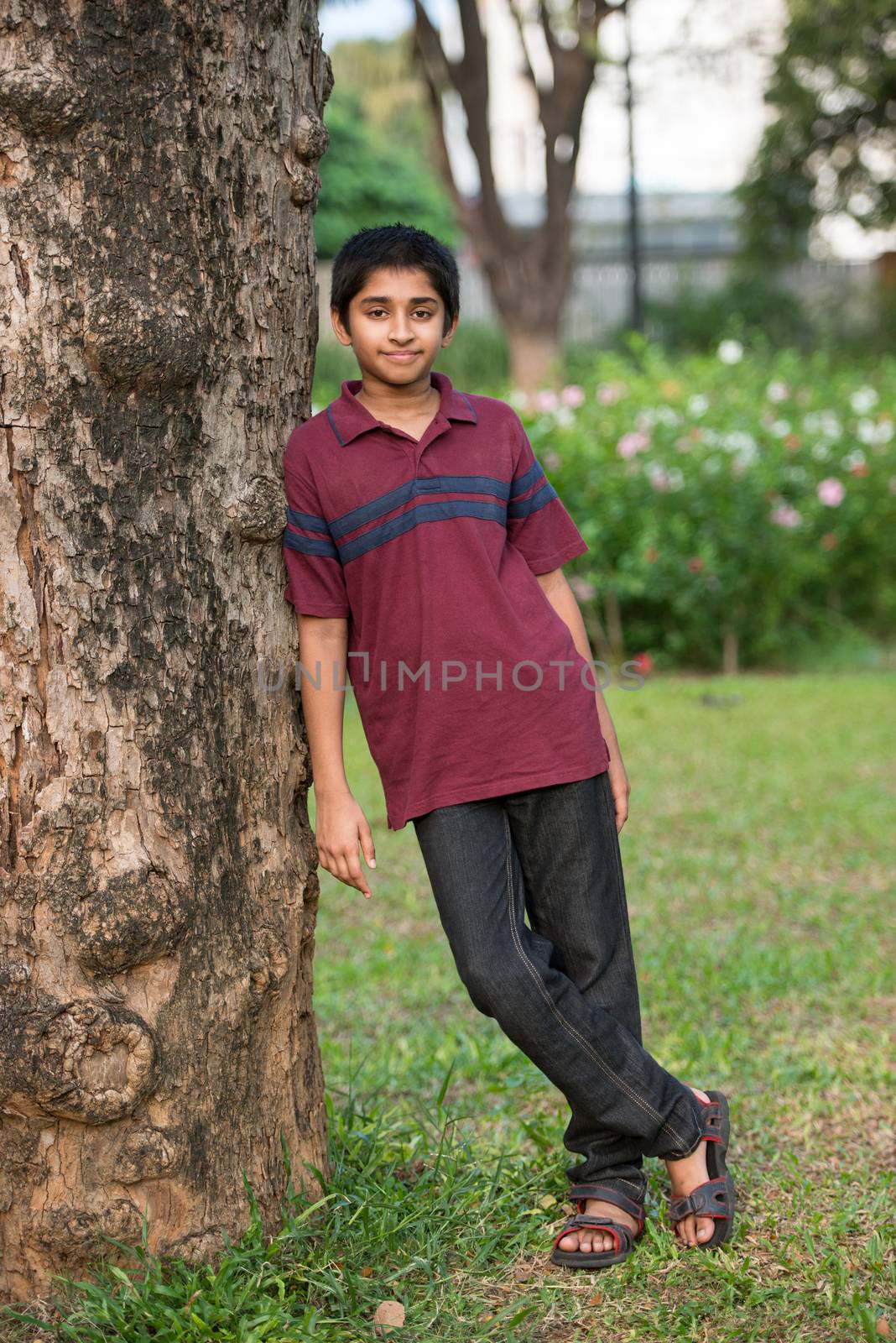 Handsome Indian toddler standing outdoor smiling