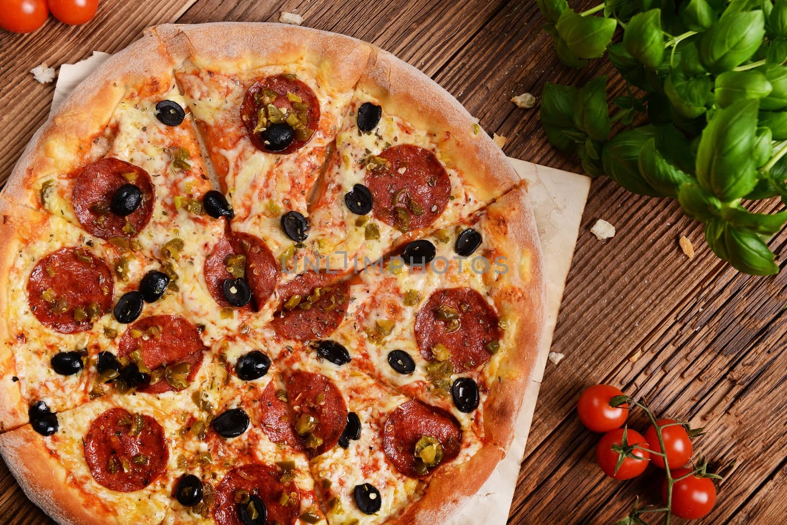 Tasty pizza with olives and salami
