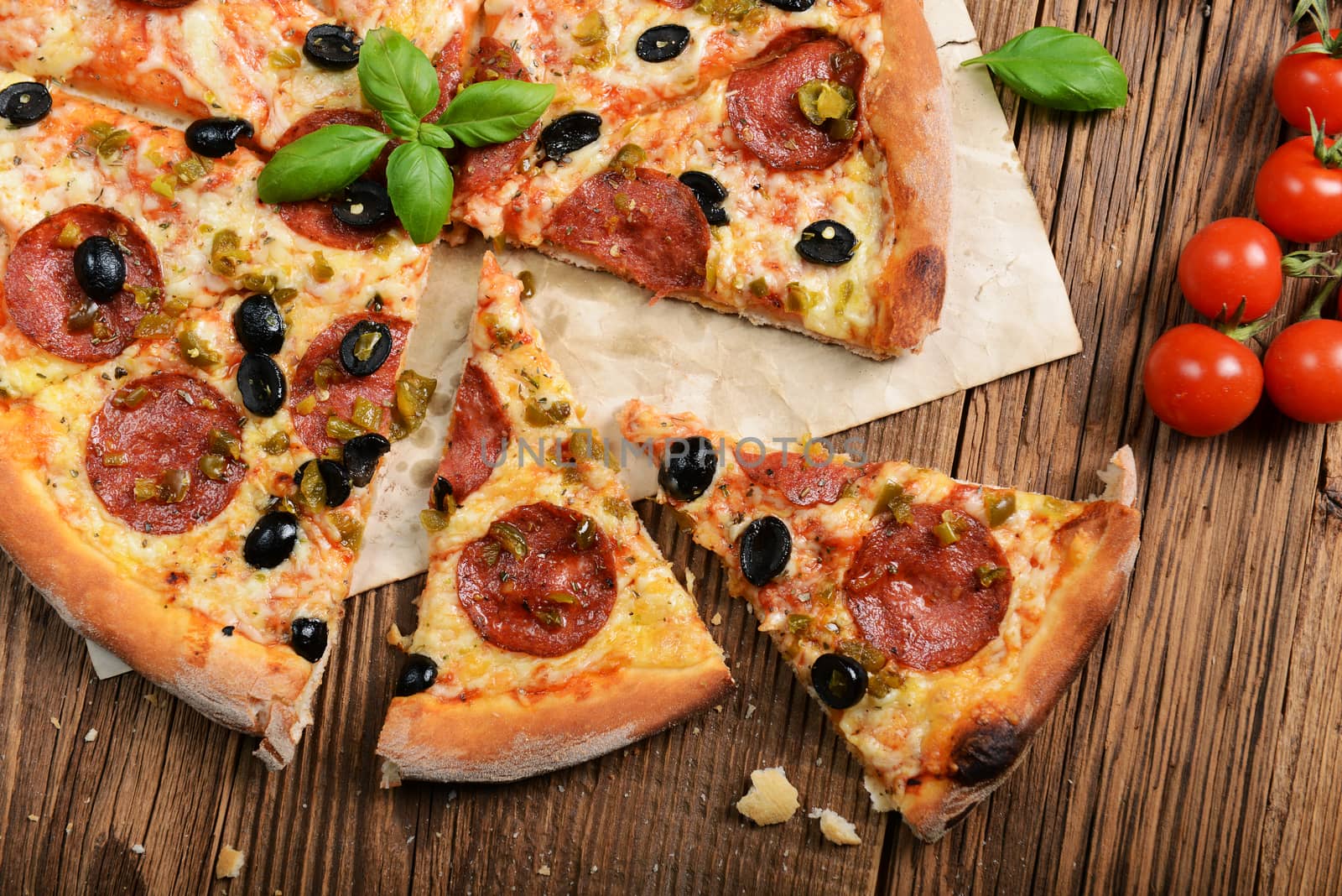 Tasty pizza with olives and salami
