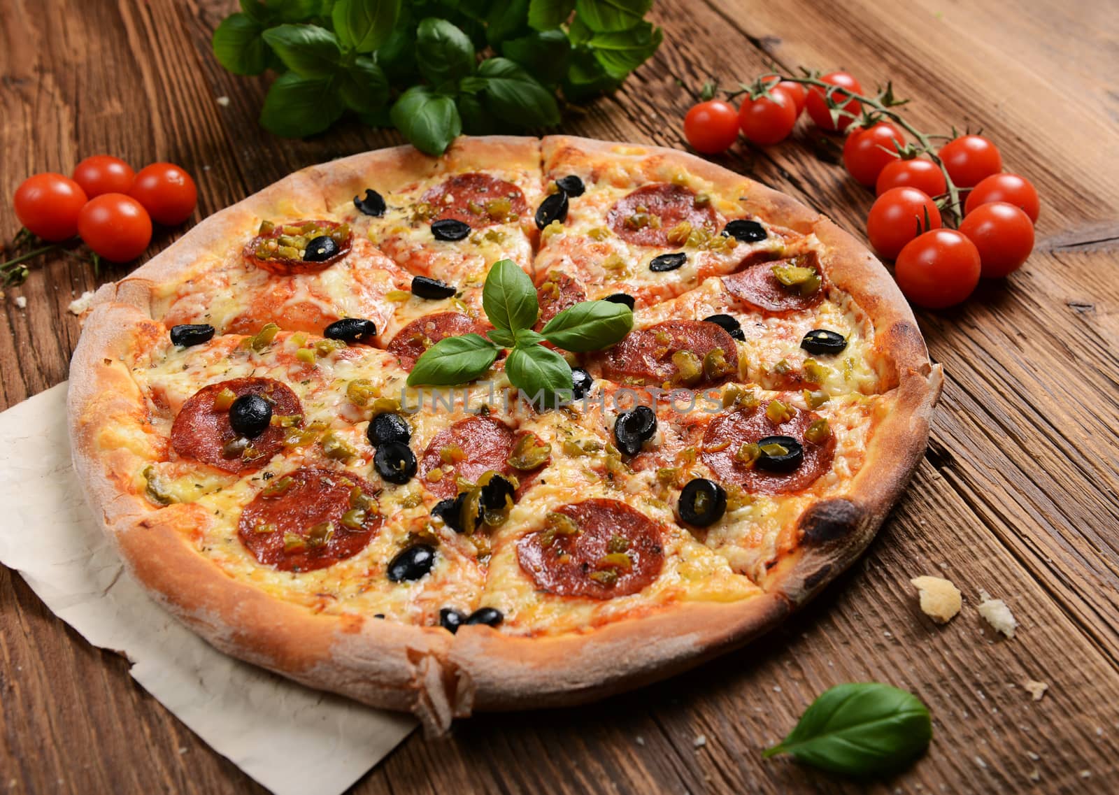 Tasty pizza with olives and salami