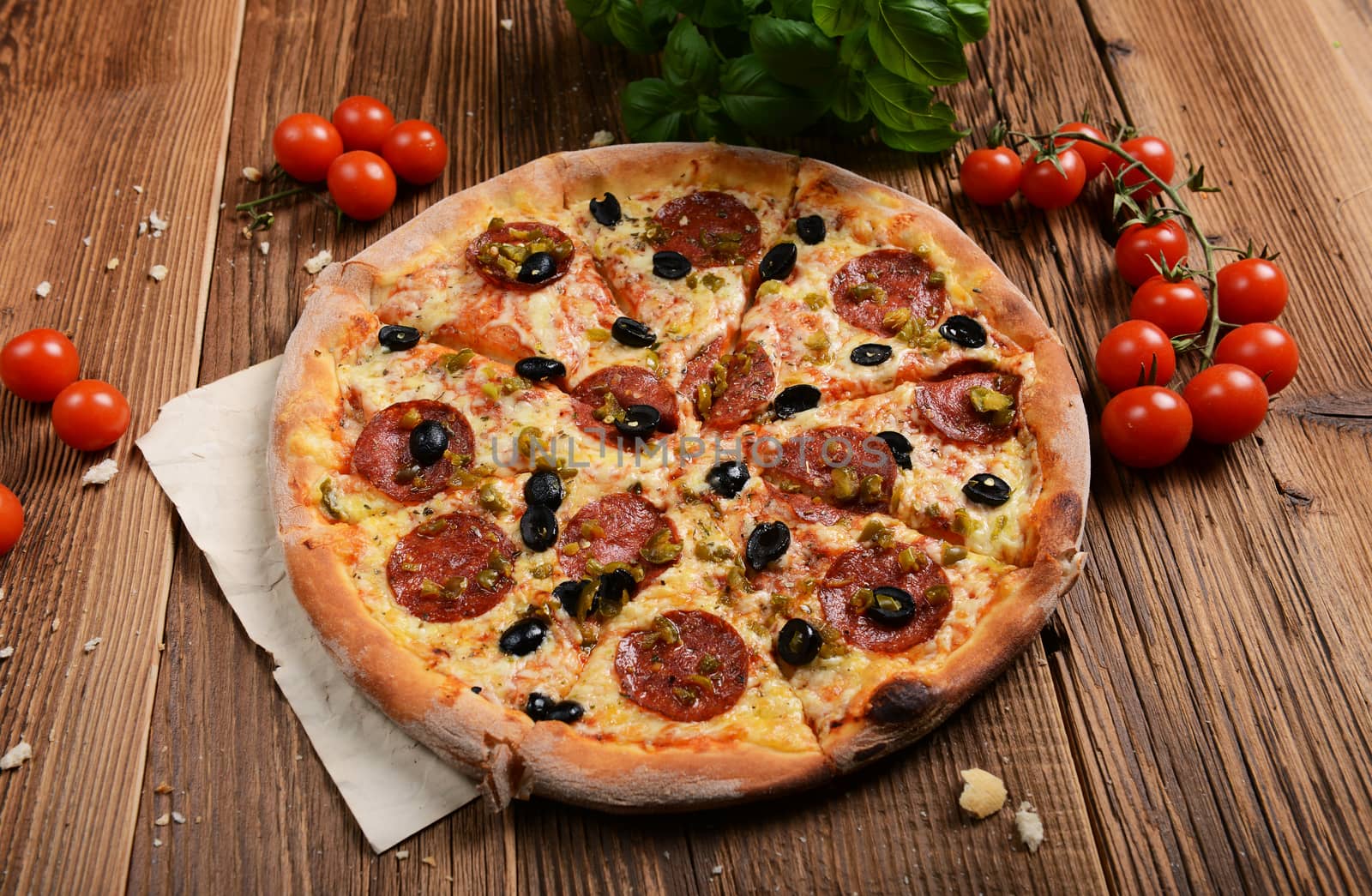 Tasty pizza with olives and salami