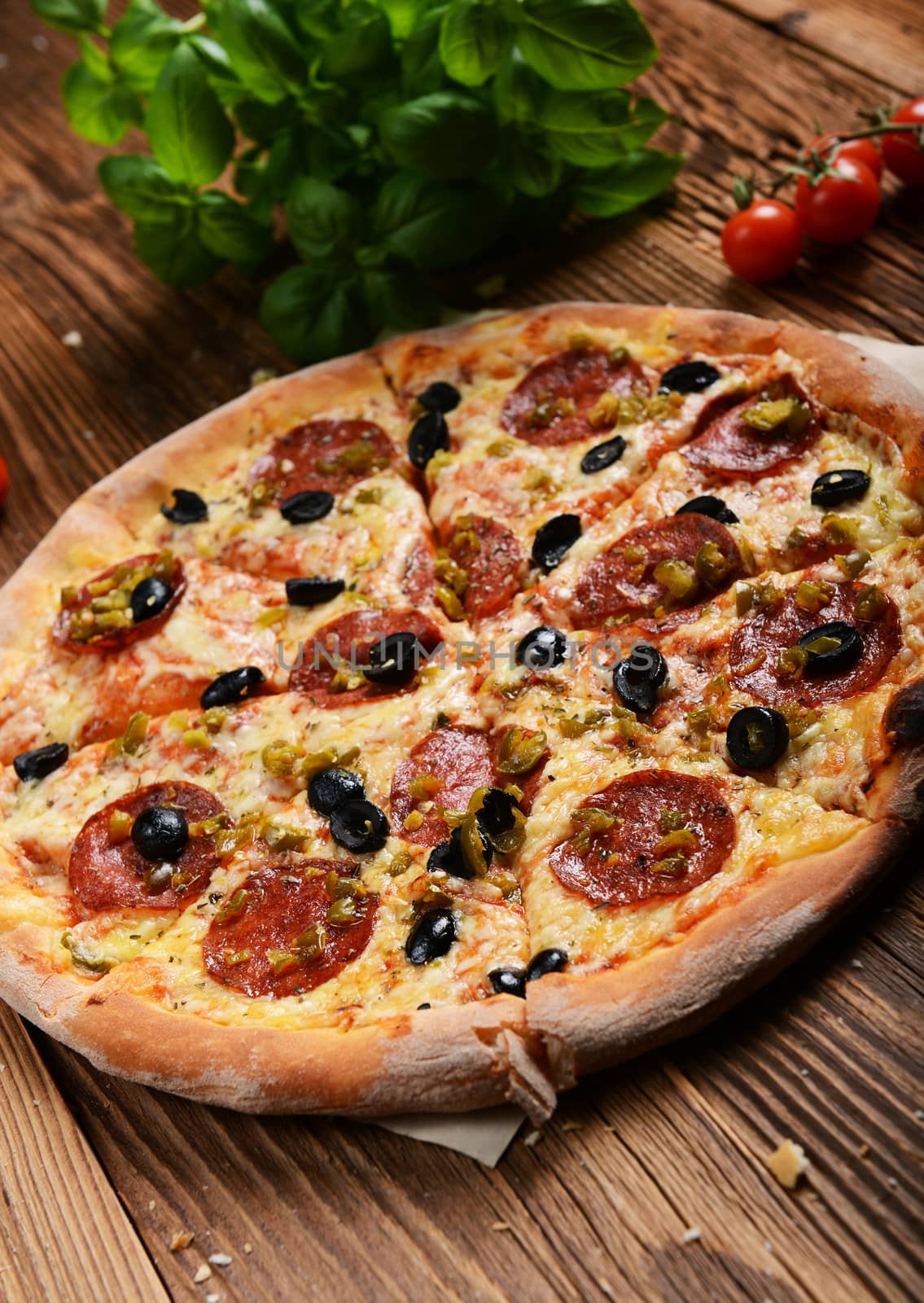 Tasty pizza with olives and salami