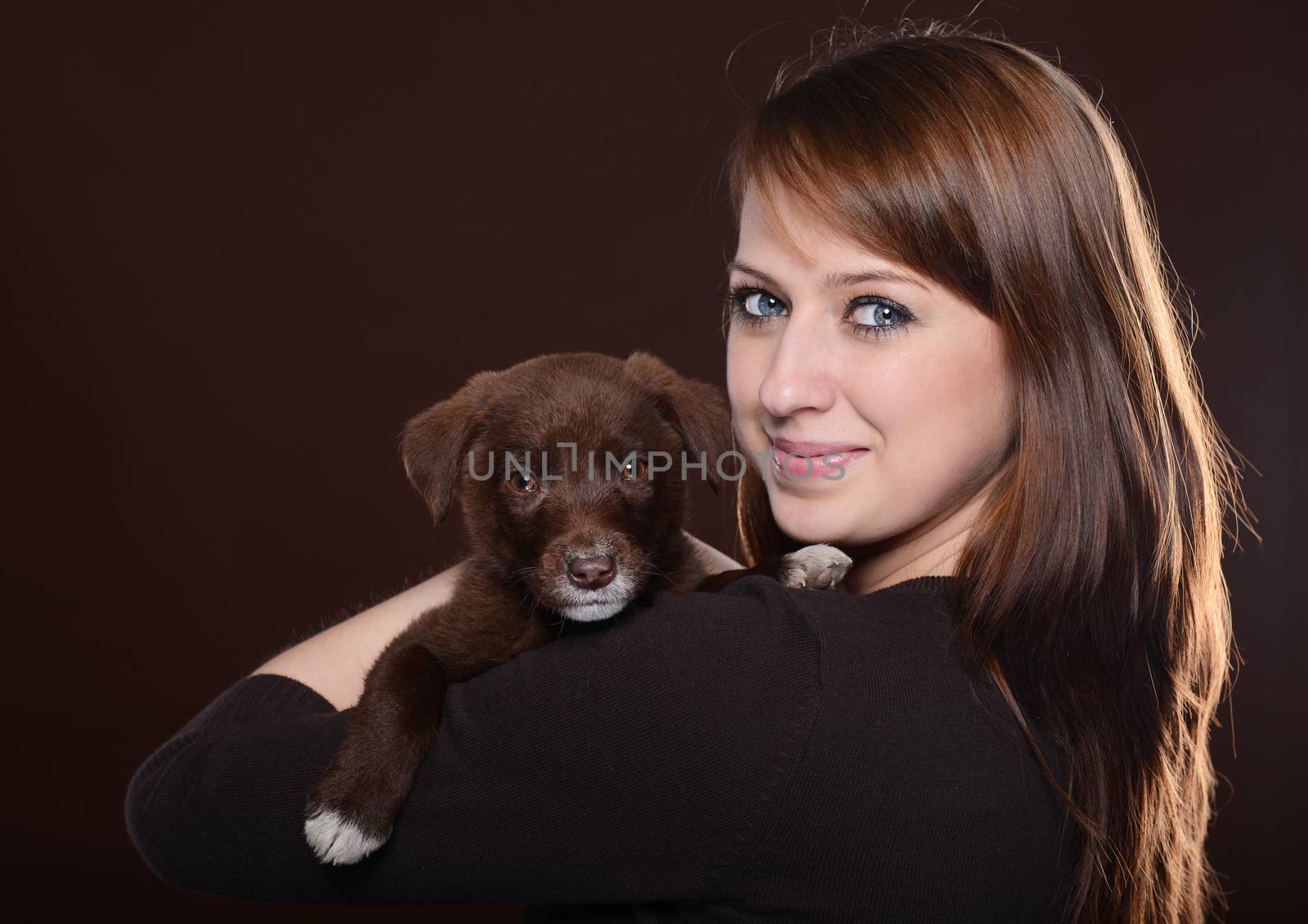 woman with dog on brown background