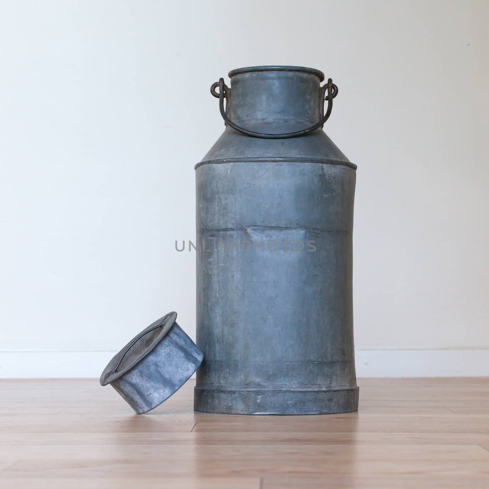 Old metal milk can by michaklootwijk
