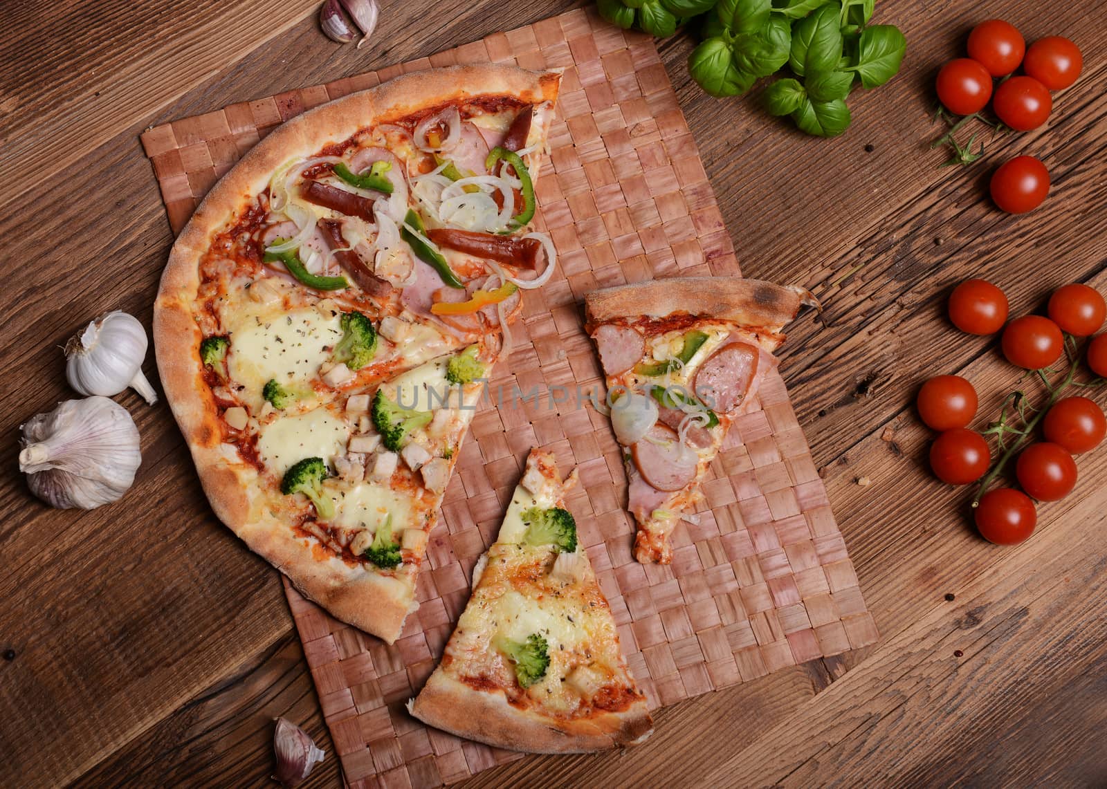 Tasty pizza with broccoli on old wooden background