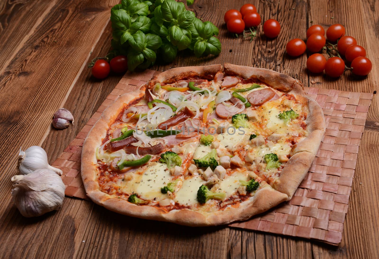 Tasty pizza with broccoli on old wooden background