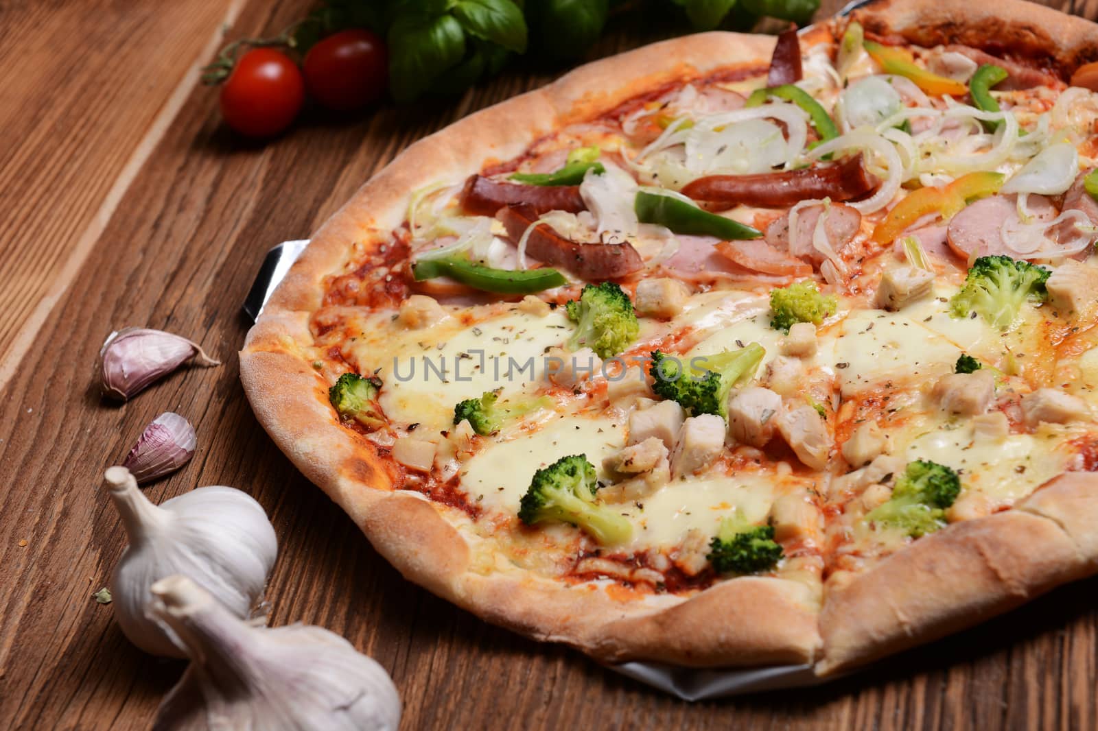 Tasty pizza with broccoli on old wooden background